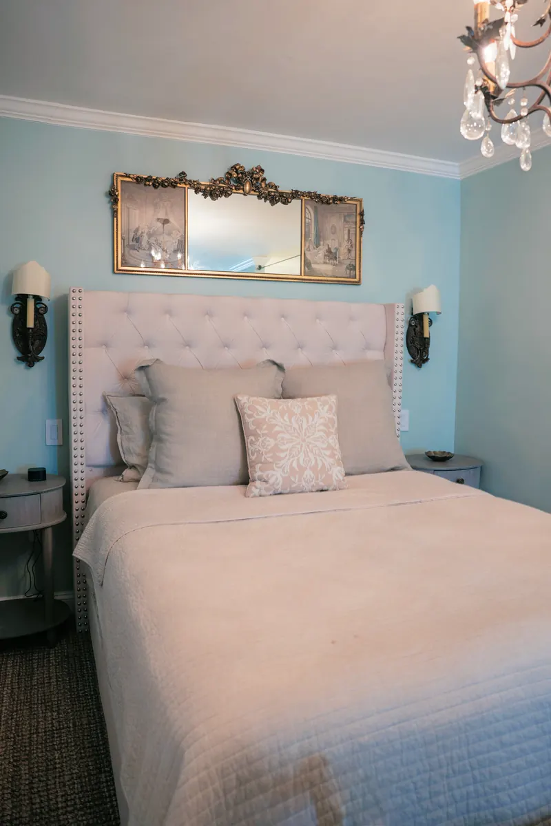 Marseille — the bed against a blue-washed wall.